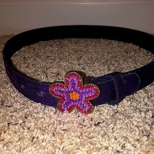 This is a used purple sparkly belt. Slightly damages from use.